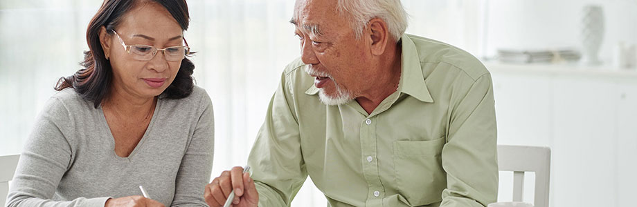 senior couple discussing documents