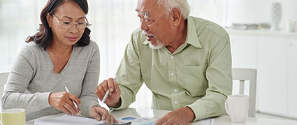 senior couple discussing documents
