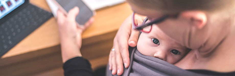 mom carrying a baby