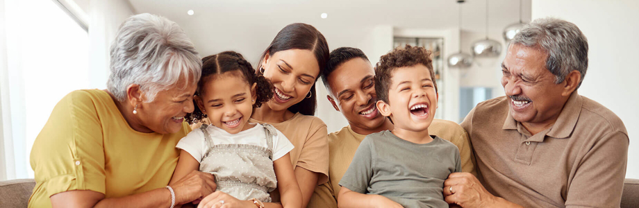multigeneration family sitting on a couch