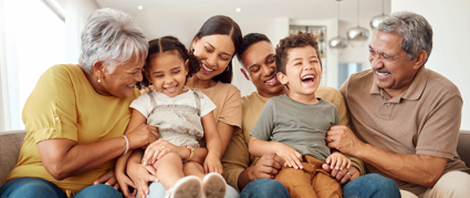 multigeneration family sitting on a couch