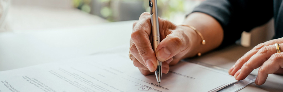 person signing an agreement document