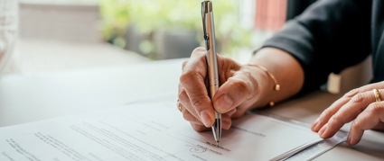 person signing an agreement document