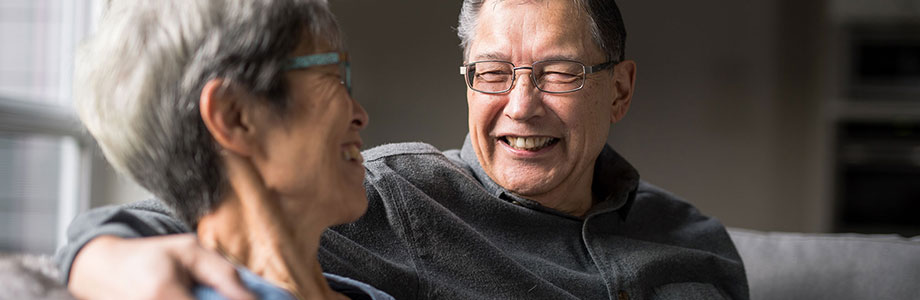 senior man smiling at his wife