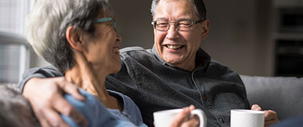 senior man smiling at his wife