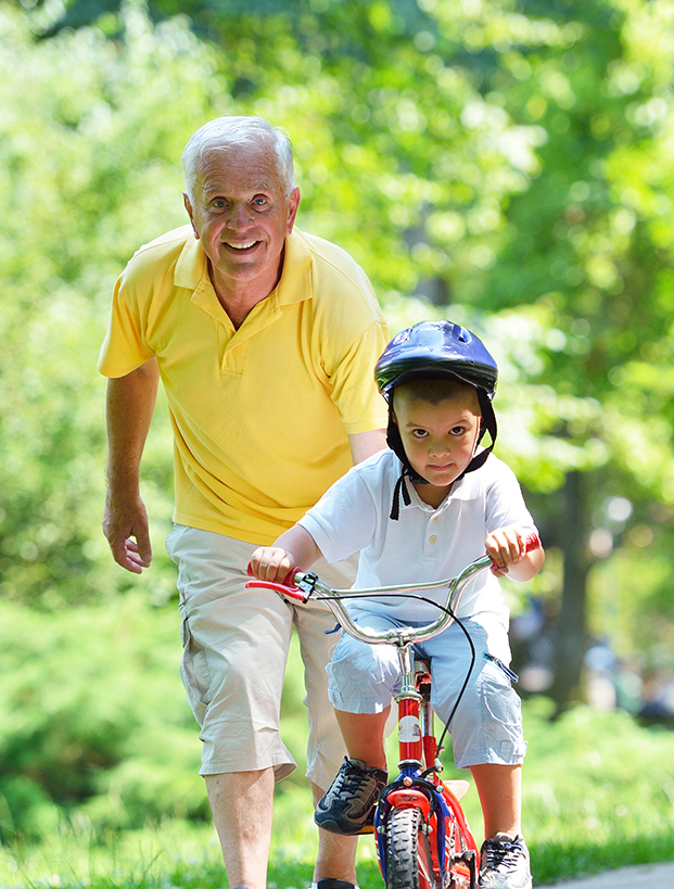 grandpa with grandson on bike