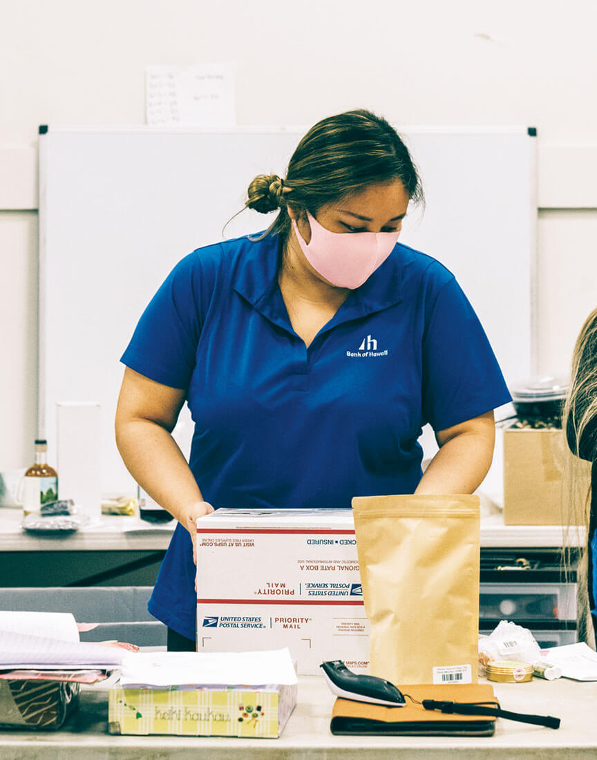 volunteer packing a box
