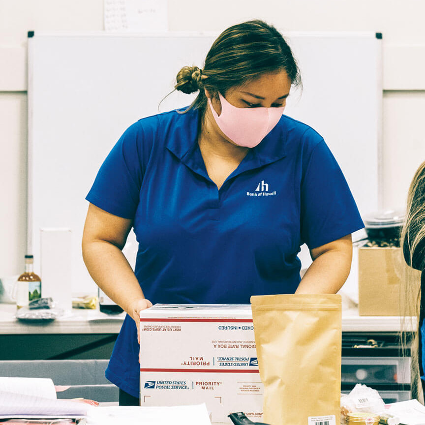 volunteer packing a box