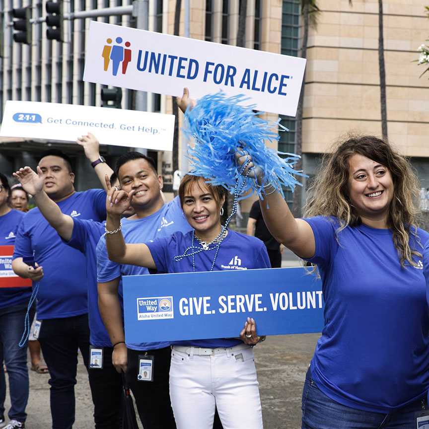 employees sign waving at AUW event