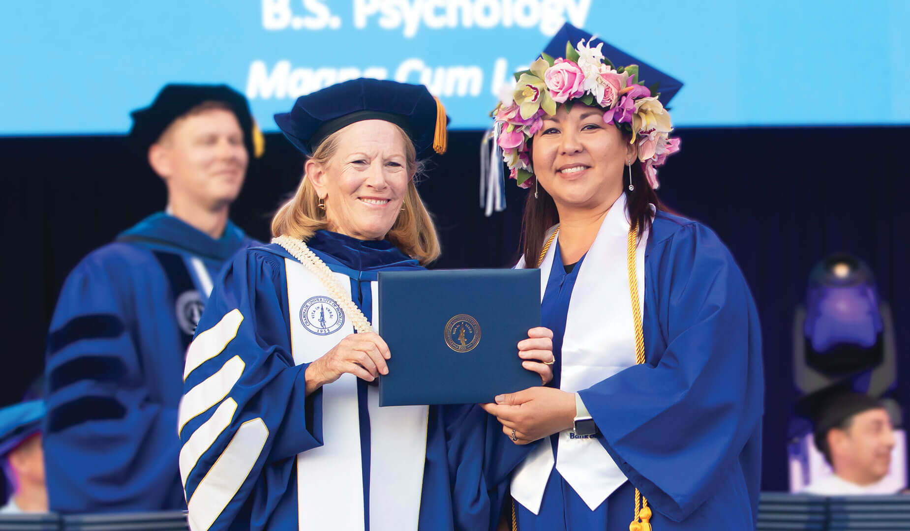 Bank of Hawaii employee Linda Yoshimoto receiving her diploma