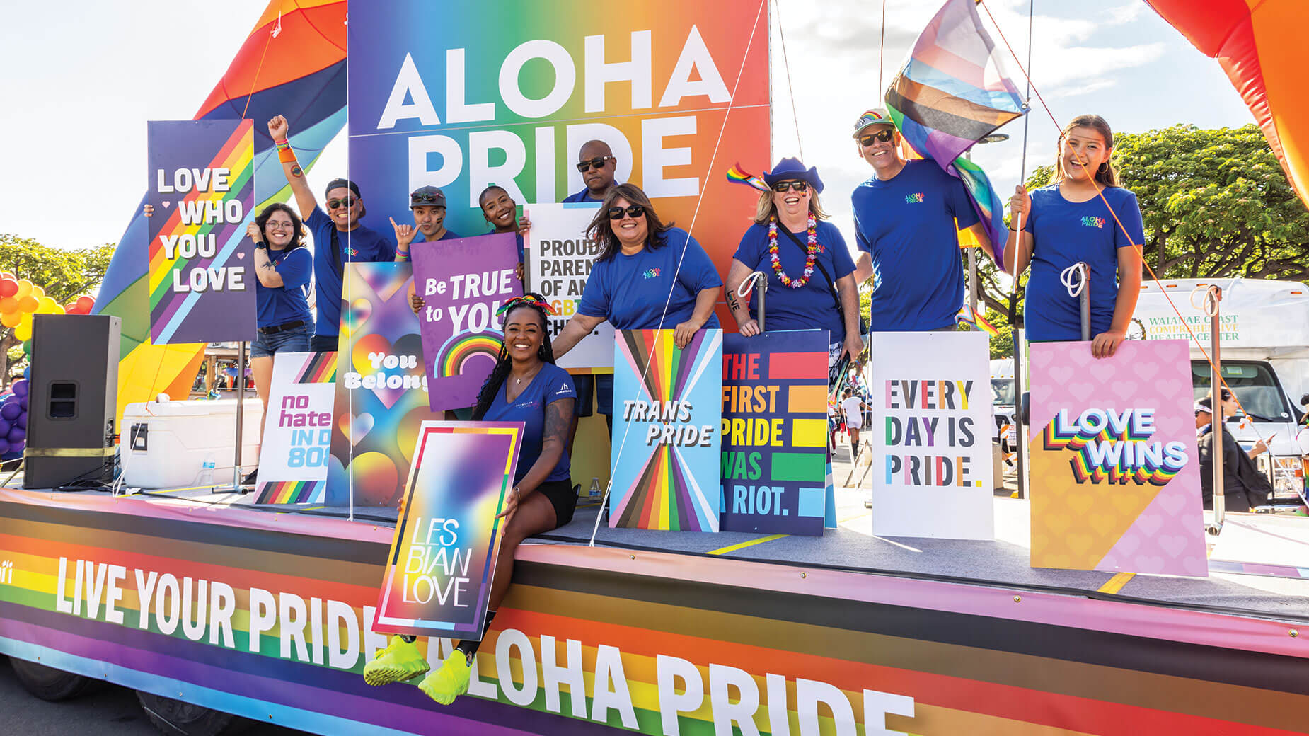 employees on Pride Parade float
