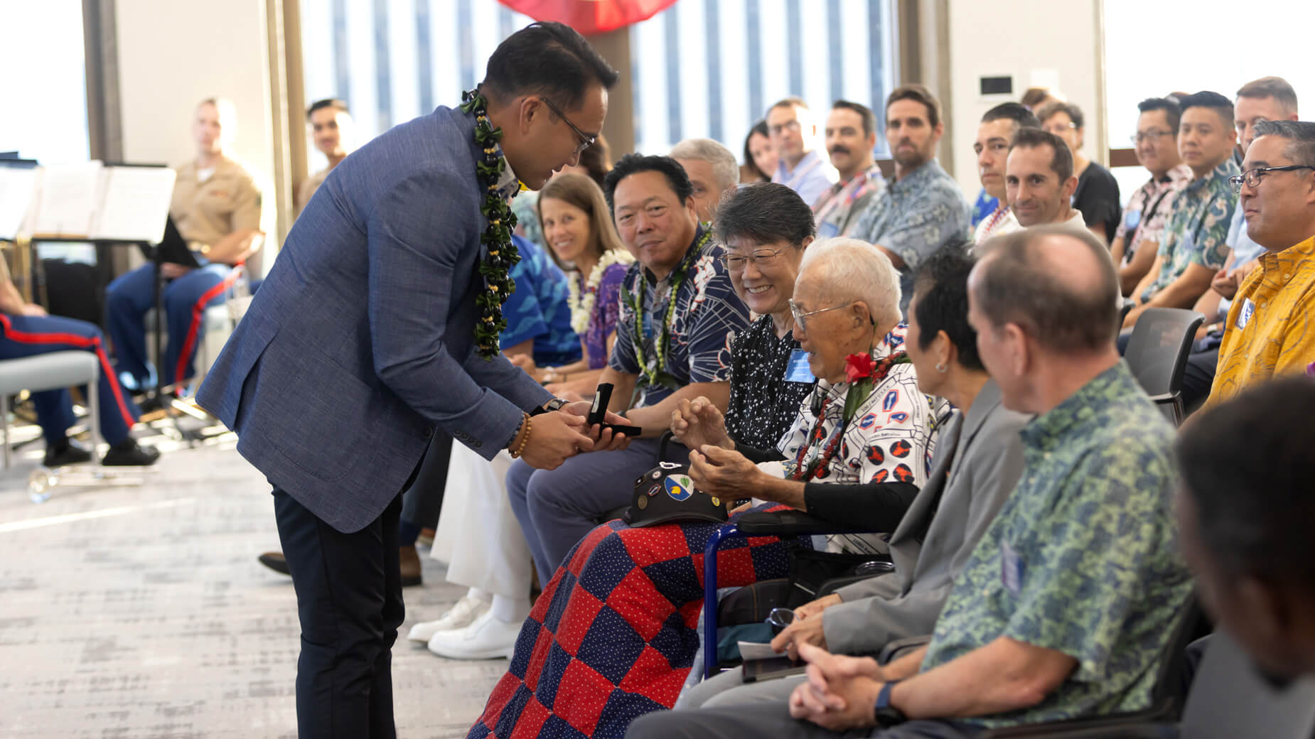 Eddie Quan presenting custom coin to veteran