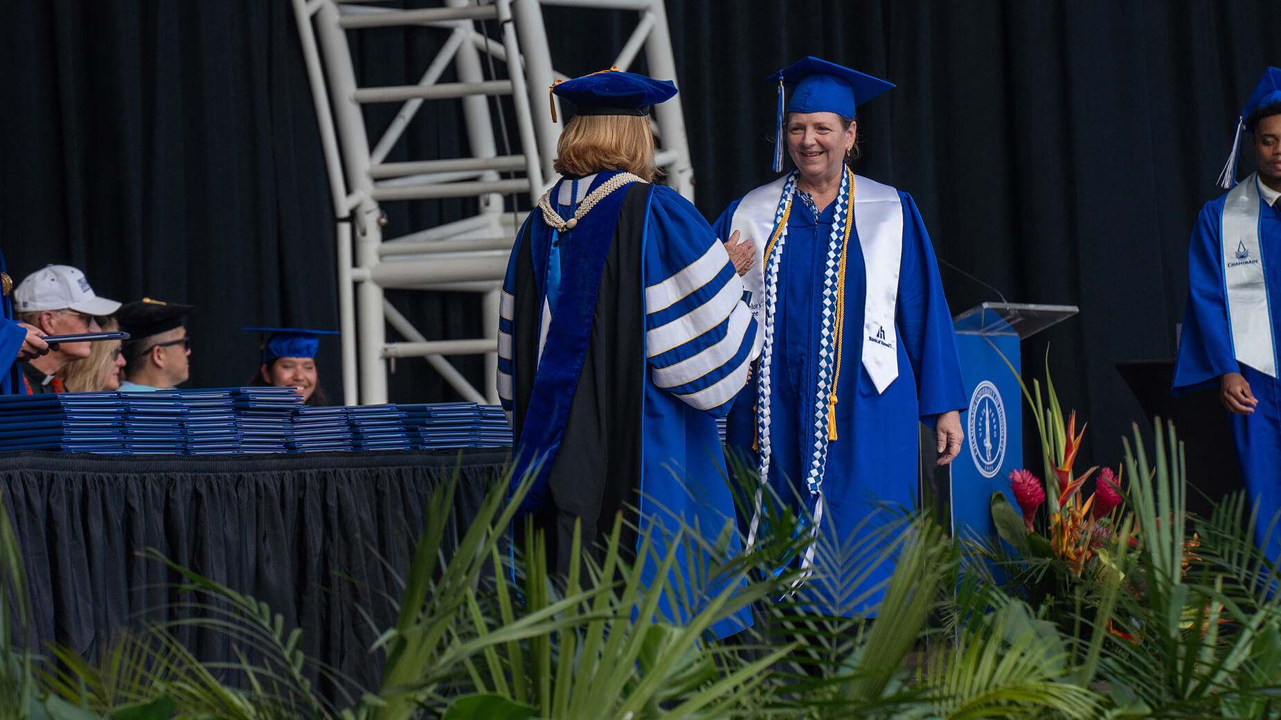 College Assistance Program graduate walking across stage
