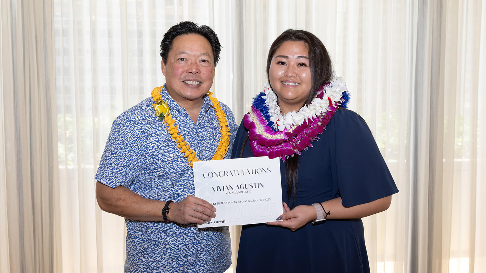 College Assistance Program graduate holding diploma with Peter Ho
