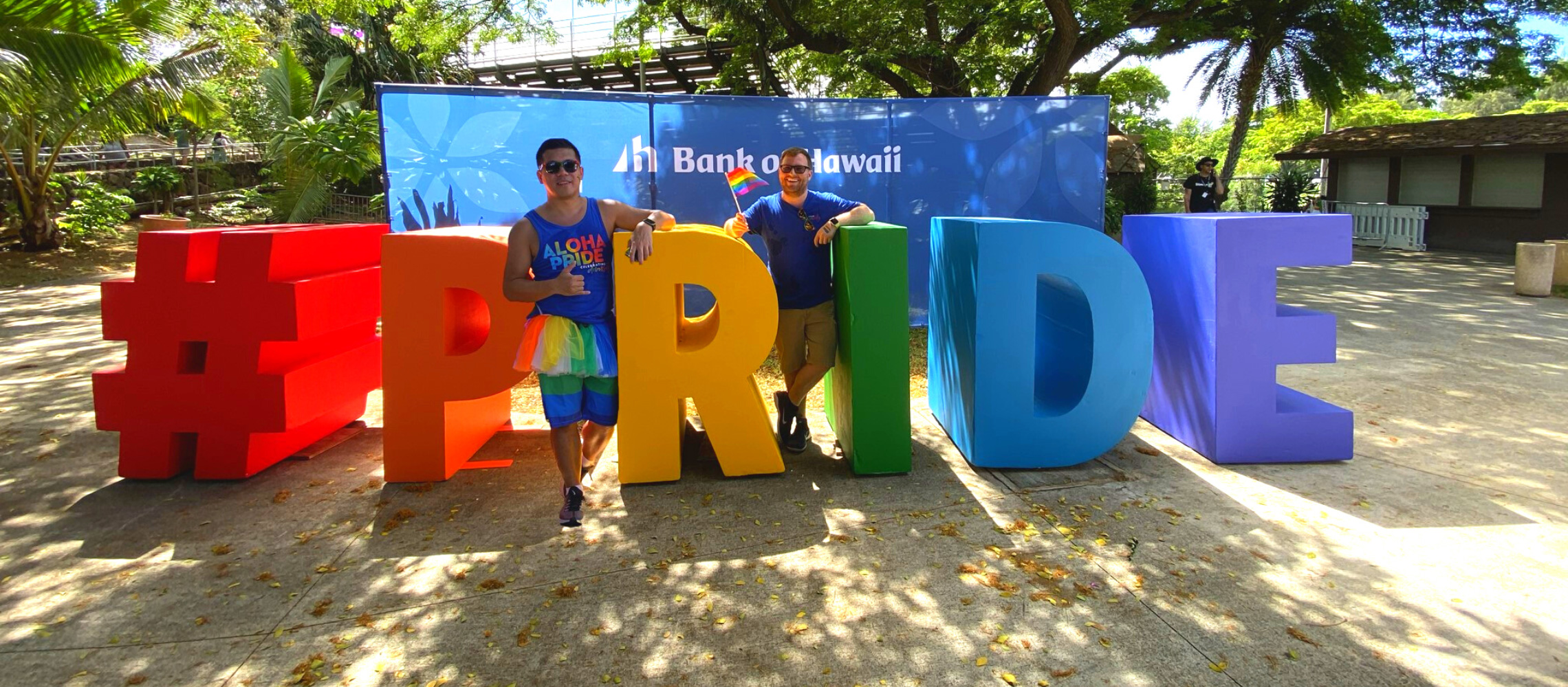 BOH Employee Noe Gumboc standing with Pride decorations