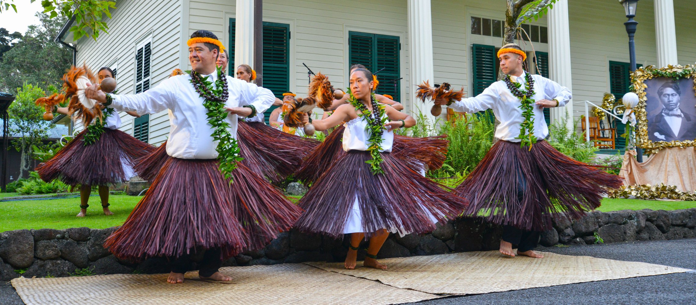 Hula dancers in front of building