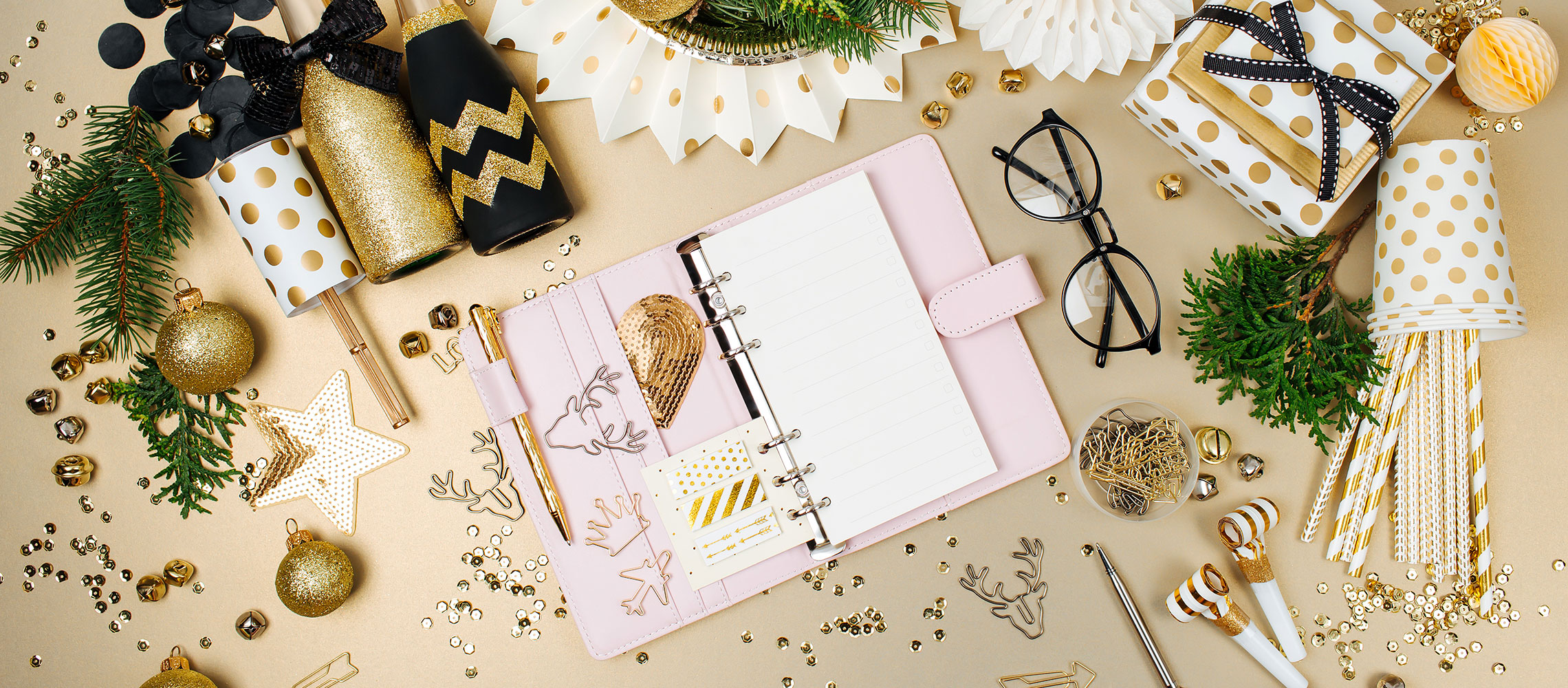 holiday planner on desk with festive accessories