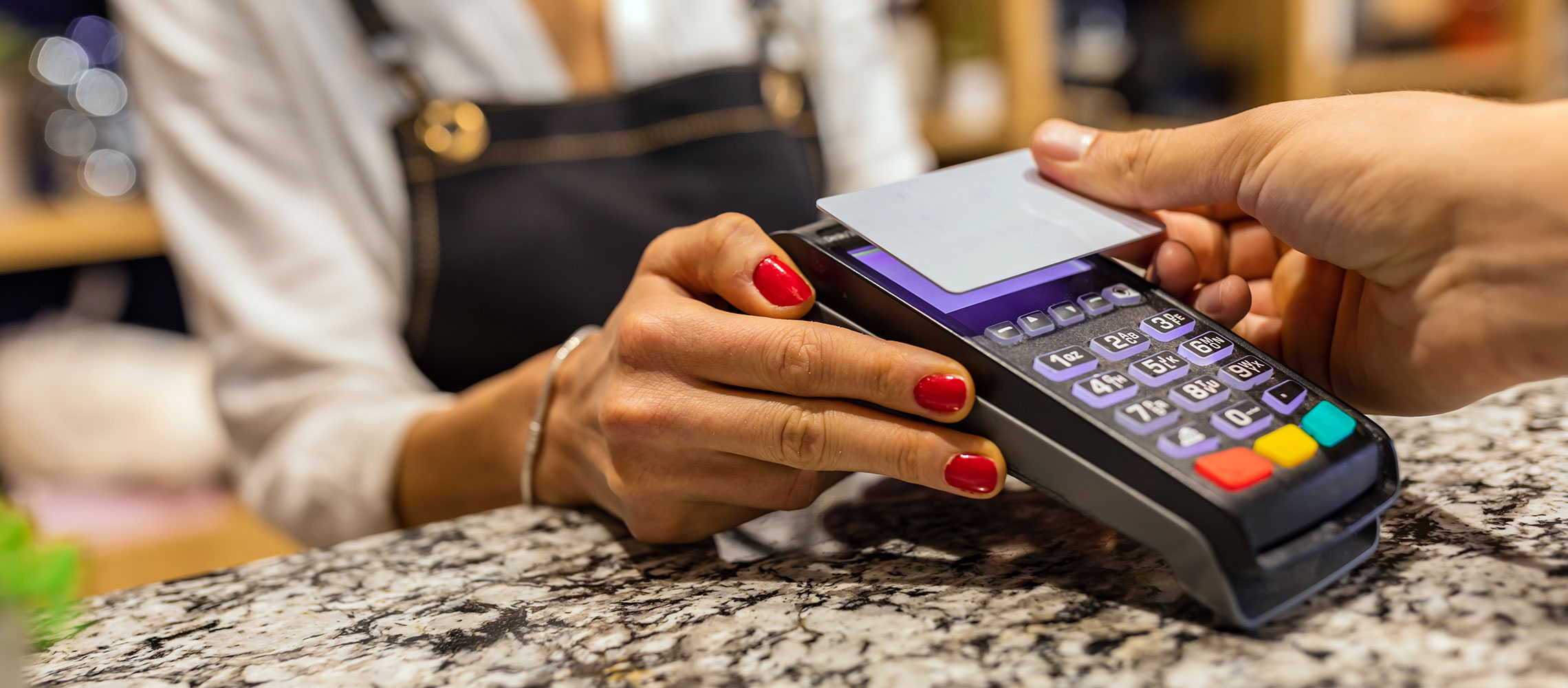 close up of a person using a contactless card