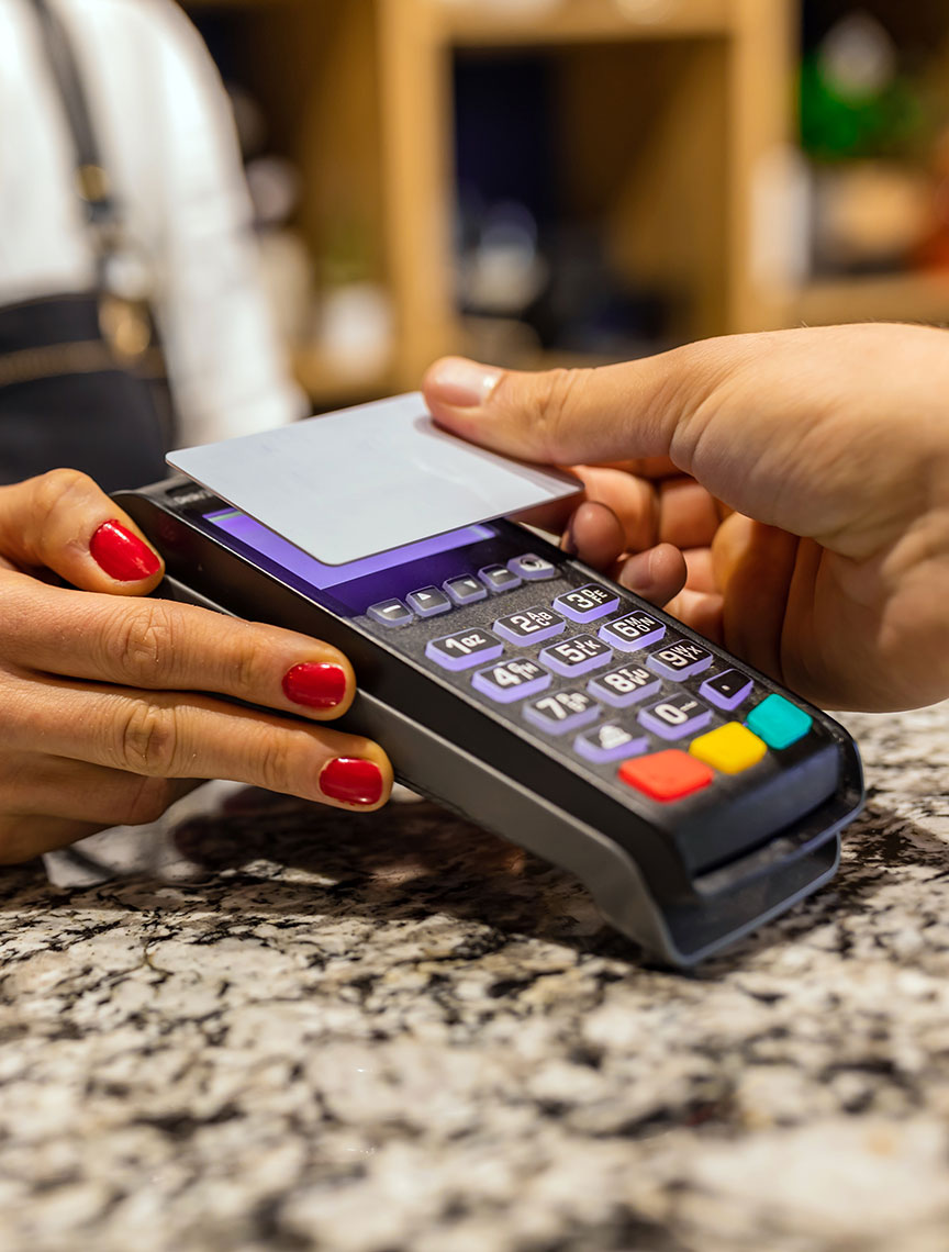 close up of a person using a contactless card