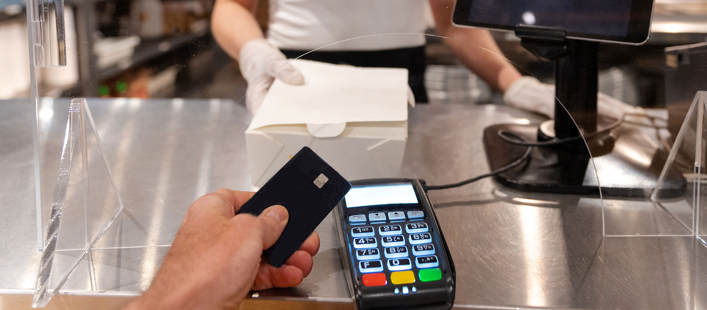 close up of a person using a contactless card