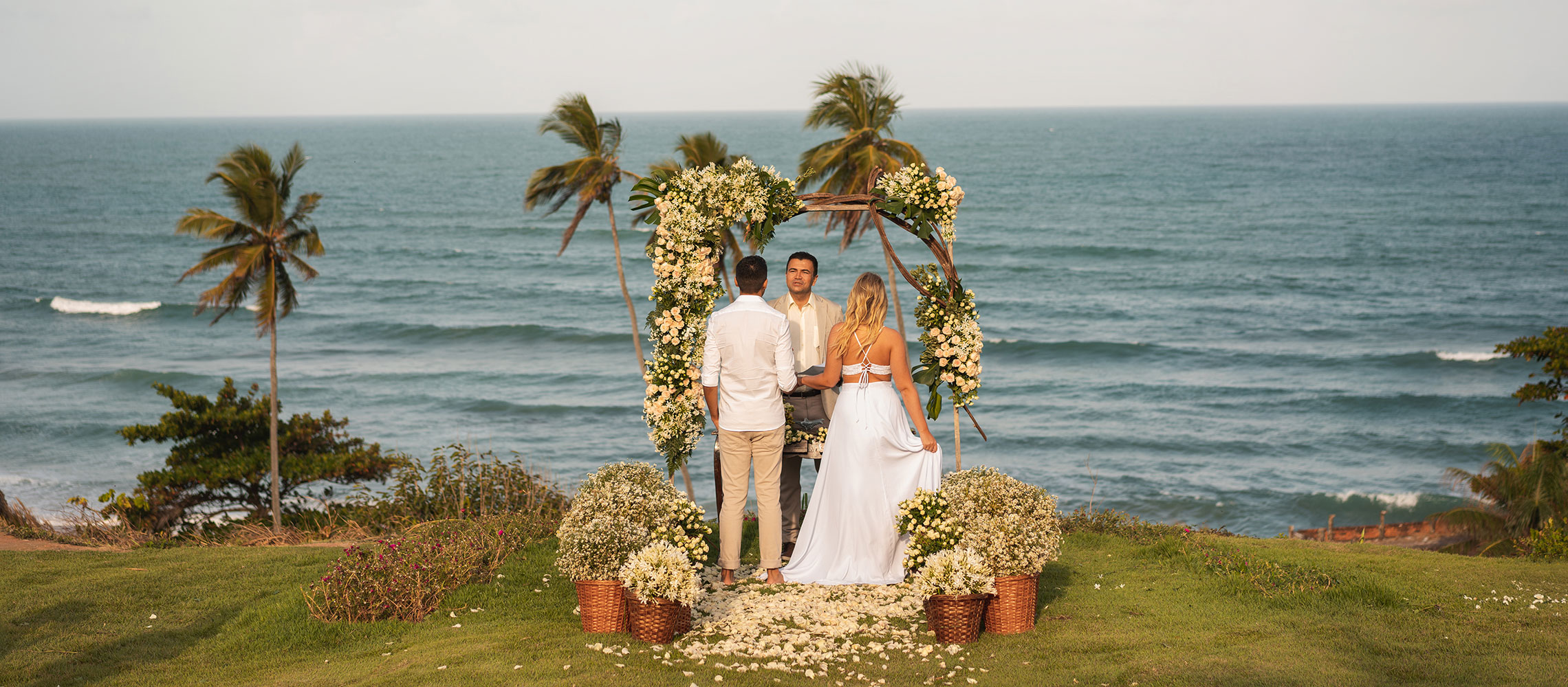 photo of a wedding ceremony by the ocean shore