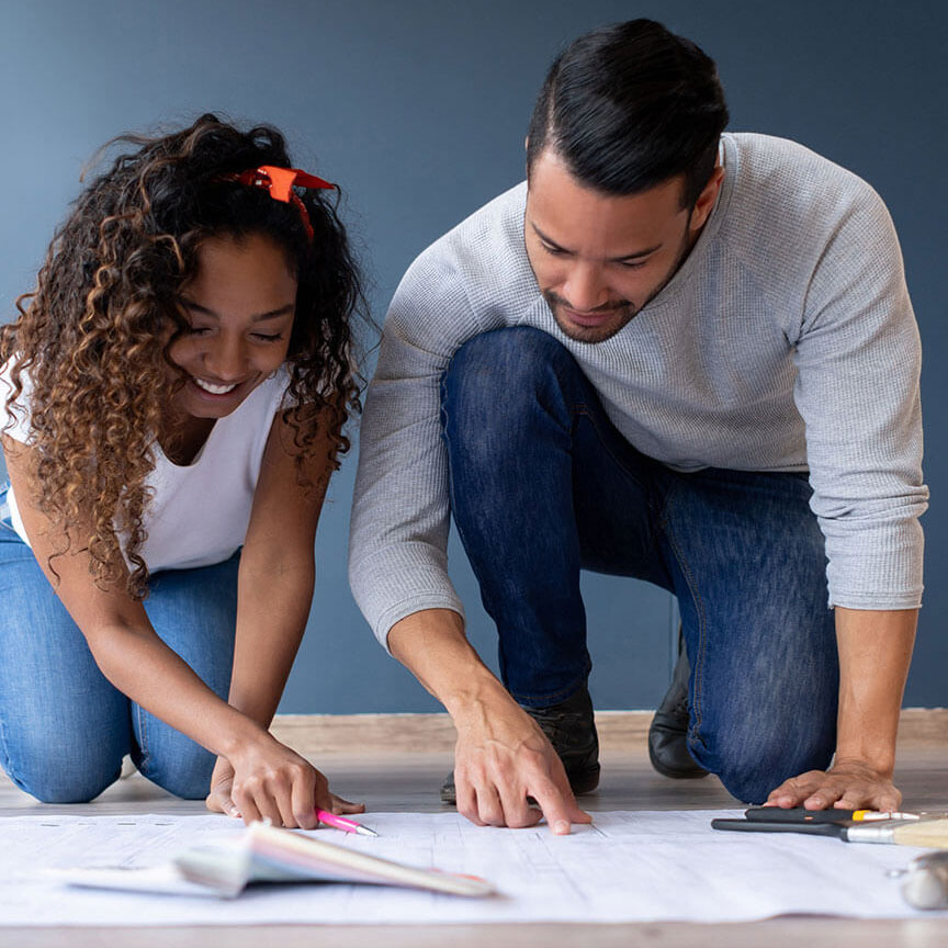 couple looking at floor plans