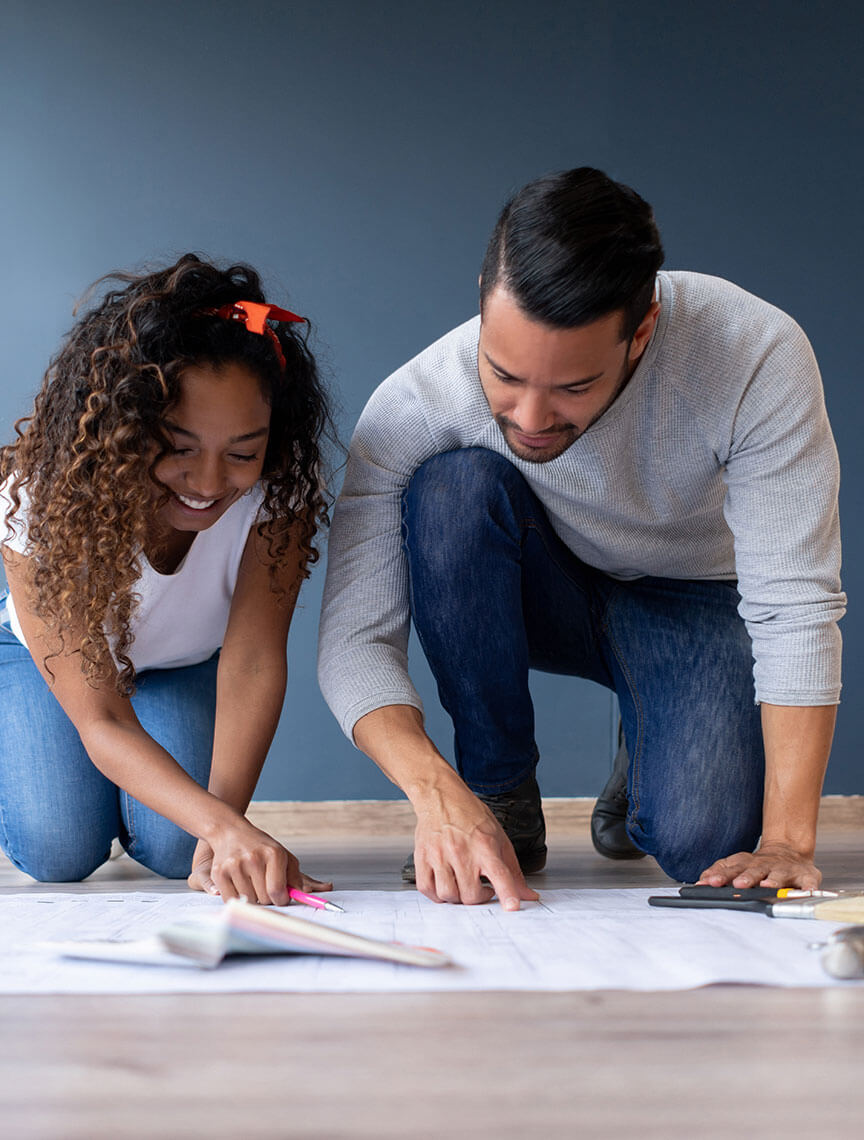 couple looking at floor plans
