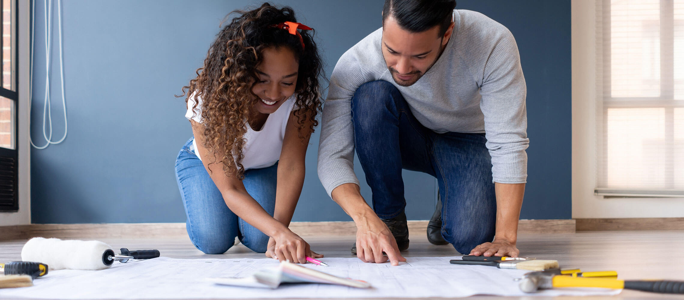 couple looking at floor plans