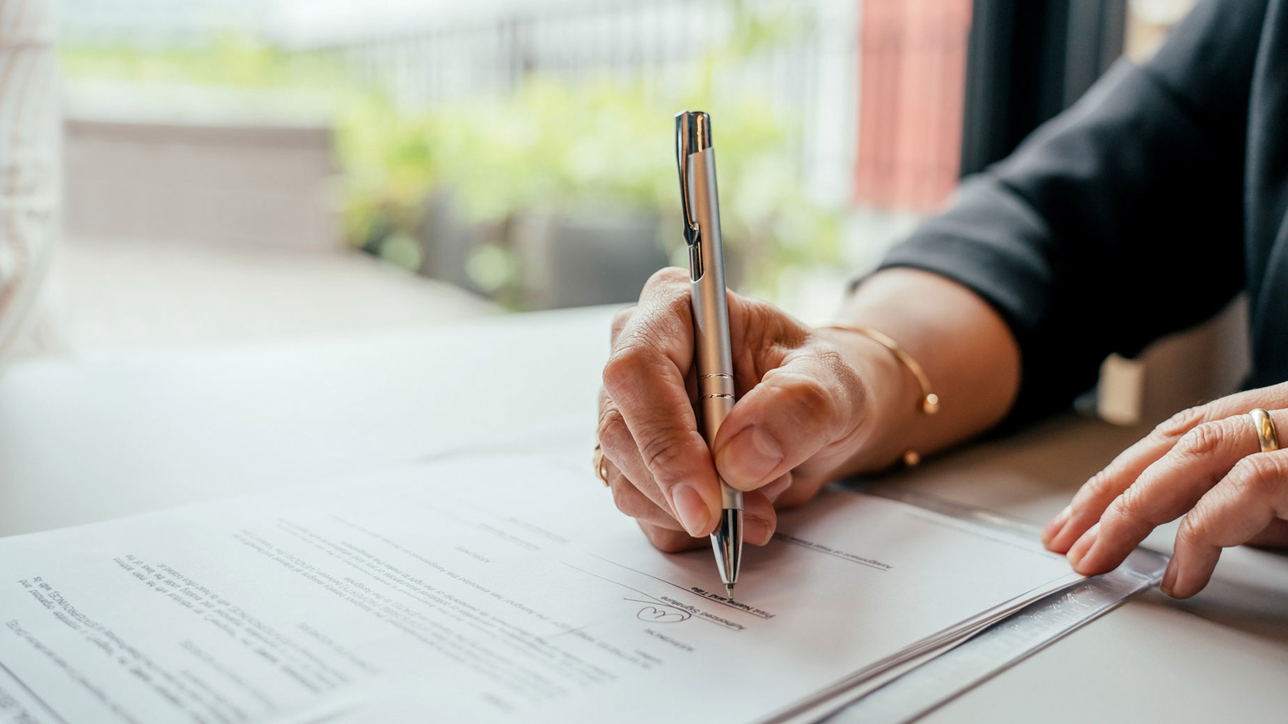 person signing an agreement document