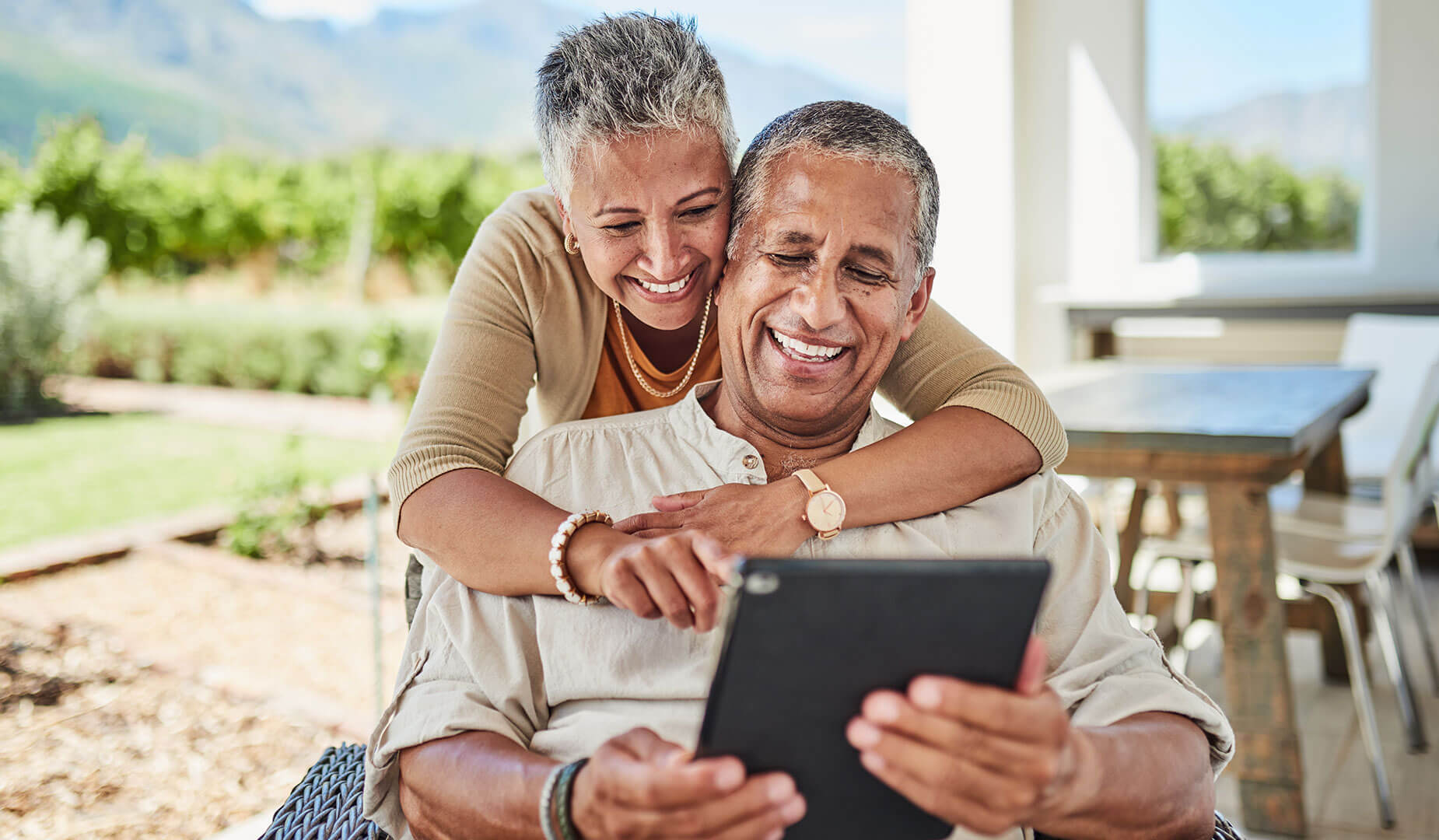 senior couple looking at tablet