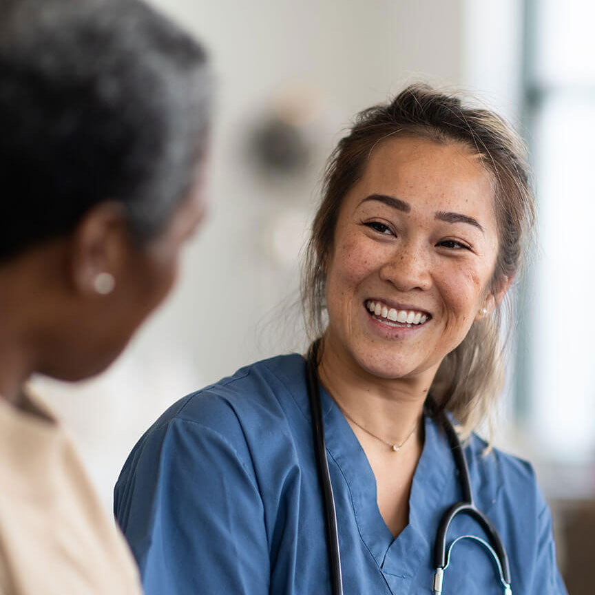 friendly nurse speaking with patient