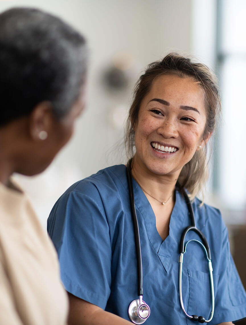 friendly nurse speaking with patient