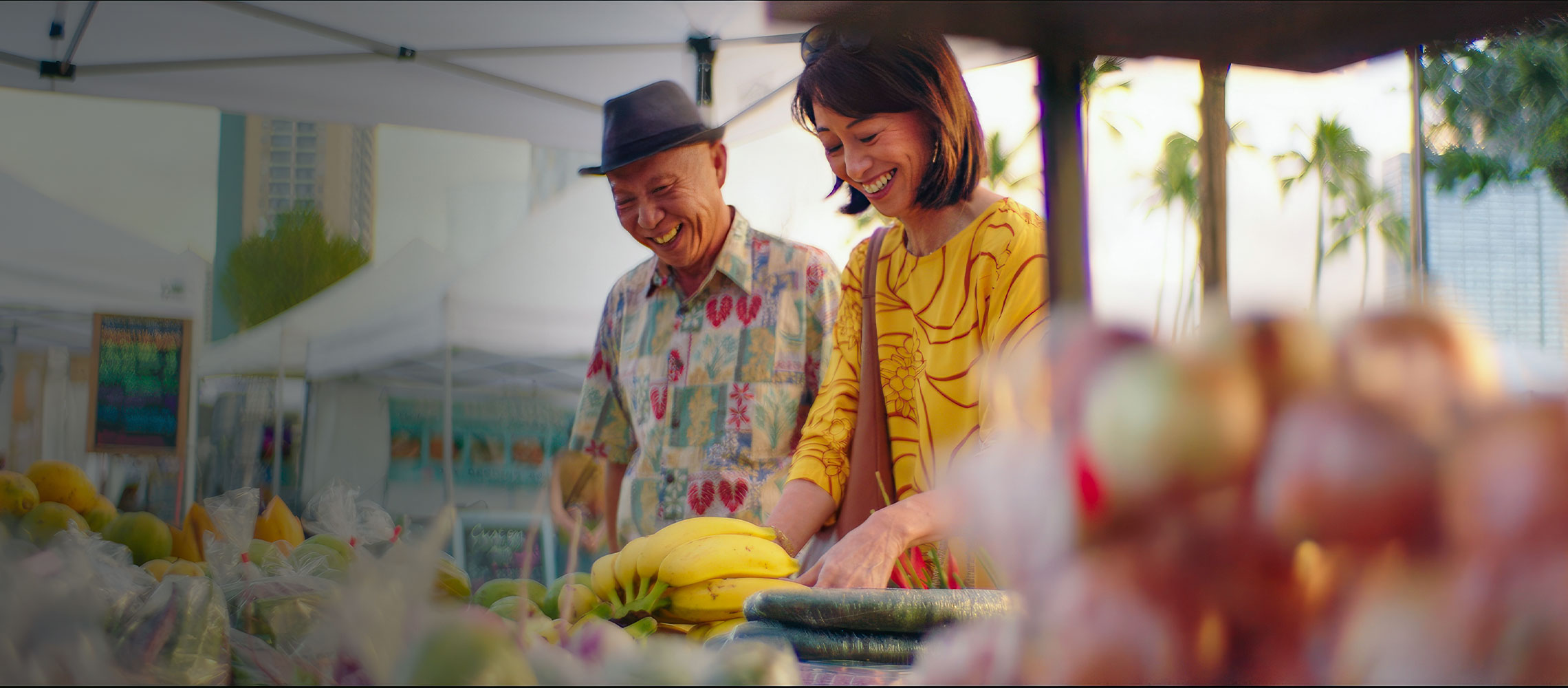 Momi picking fruit at the farmers market