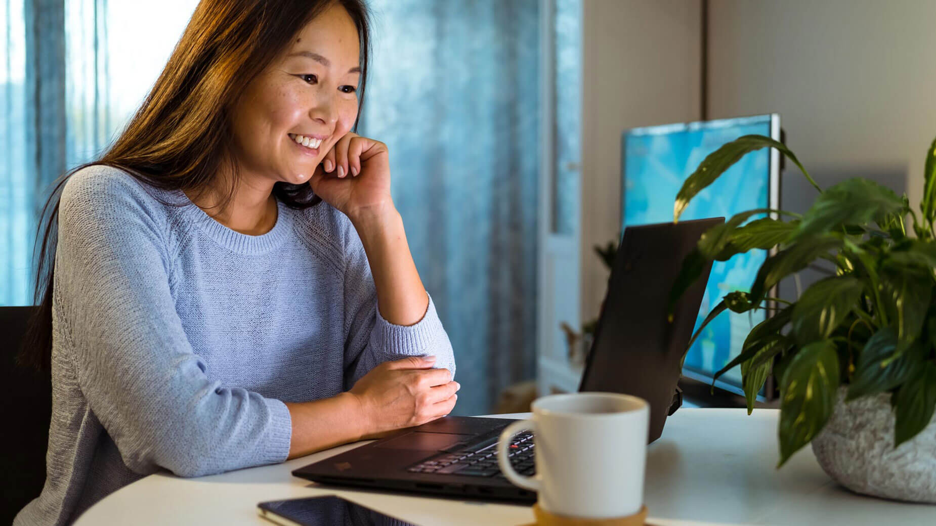 young woman looking at a laptop