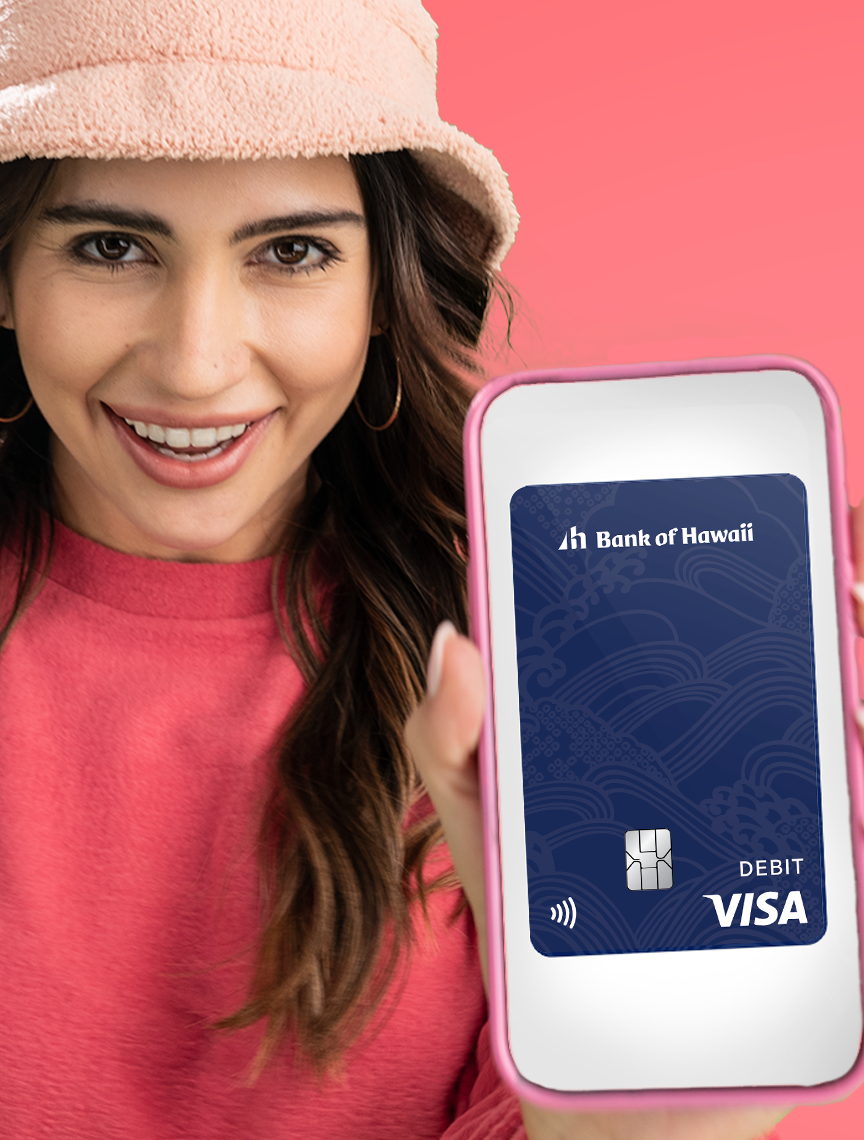 Woman holding phone with debit card on screen