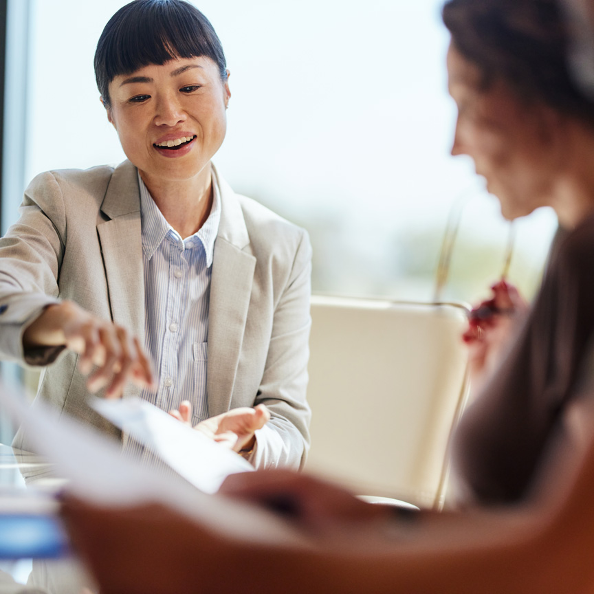 Asian business woman meeting with a client with documents