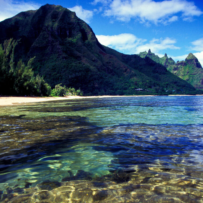 Hawaii beach with mountains in the background