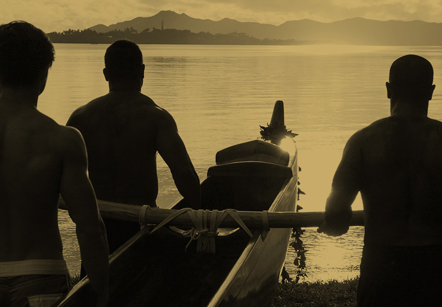 Hawaiian Canoe Carried into Bay