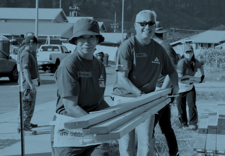 BOH Volunteers Carrying Lumber