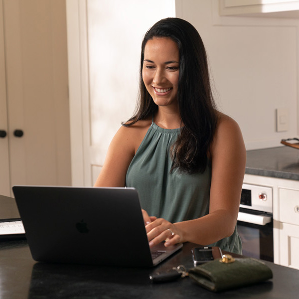 girl banking on laptop