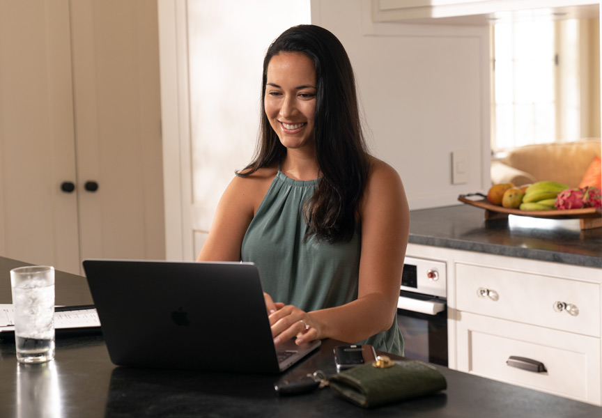 girl banking on laptop
