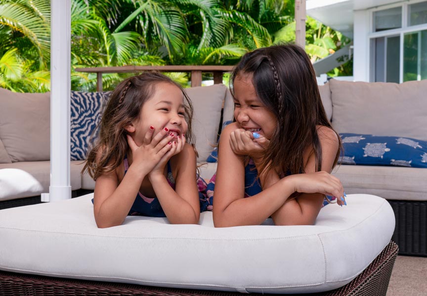 two young girls laughing