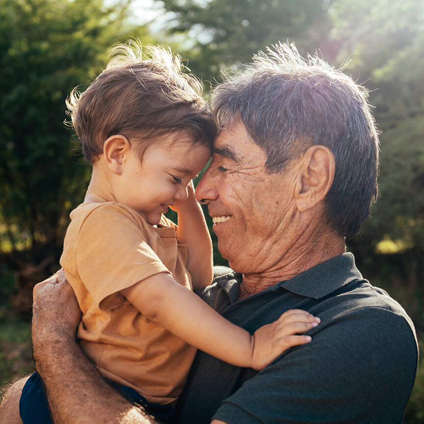 grandfather carrying grandchild