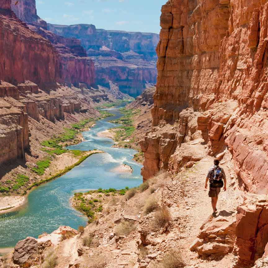 man hiking in canyon