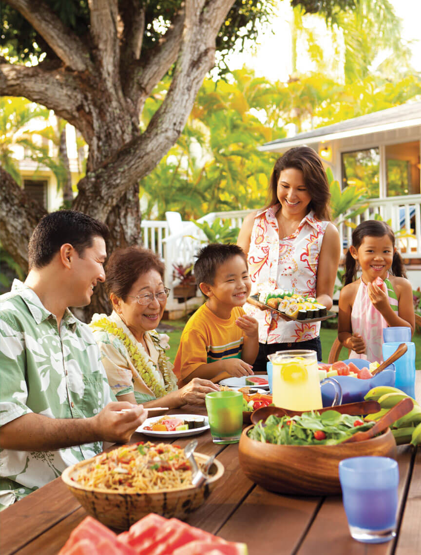 family dining in the backyard