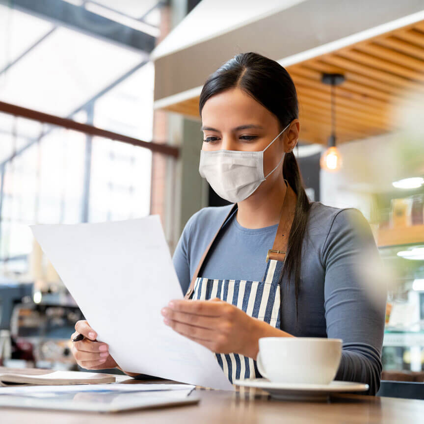 female business owner reviewing documents