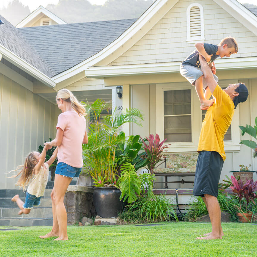 family playing in the yard