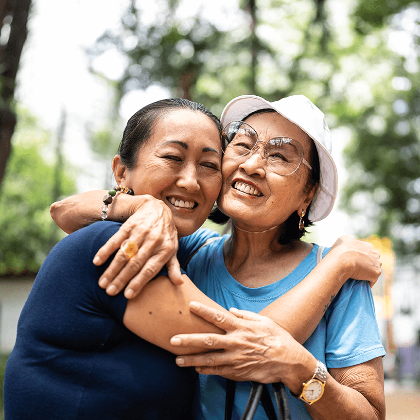 woman hugging mom outside