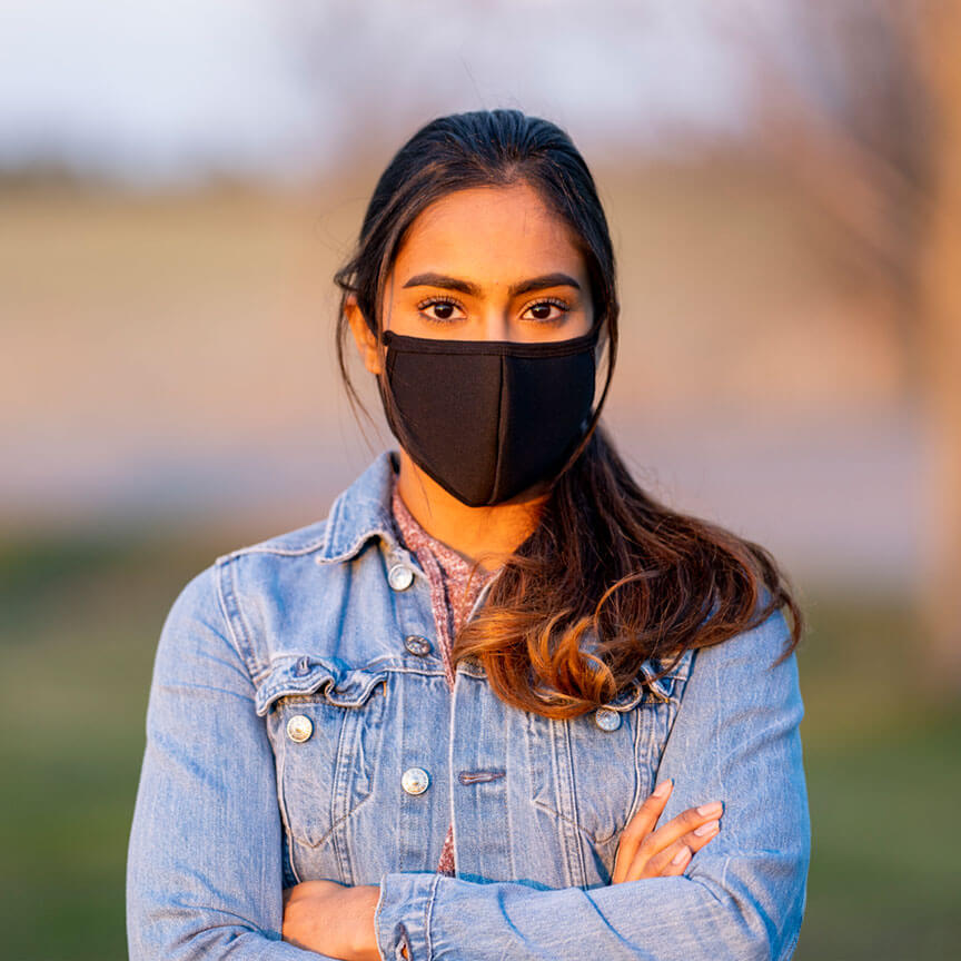 woman wearing a black face mask
