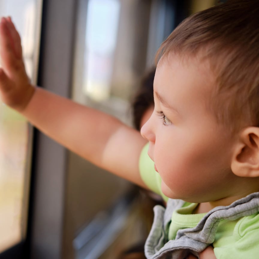 infant with outstretched hand